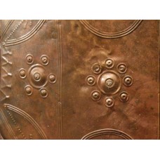 Six-point and eight-pointed solar symbol on bronze dish